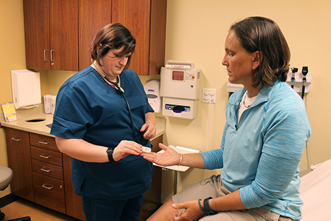 nurse working with a patient