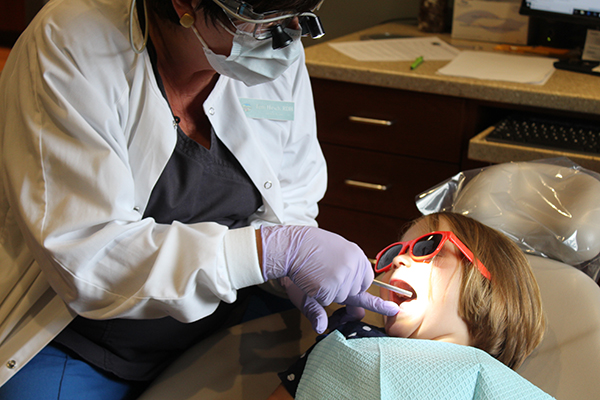 RDH with a young dental patient