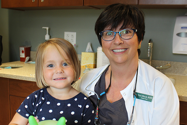 RDH with a young dental patient